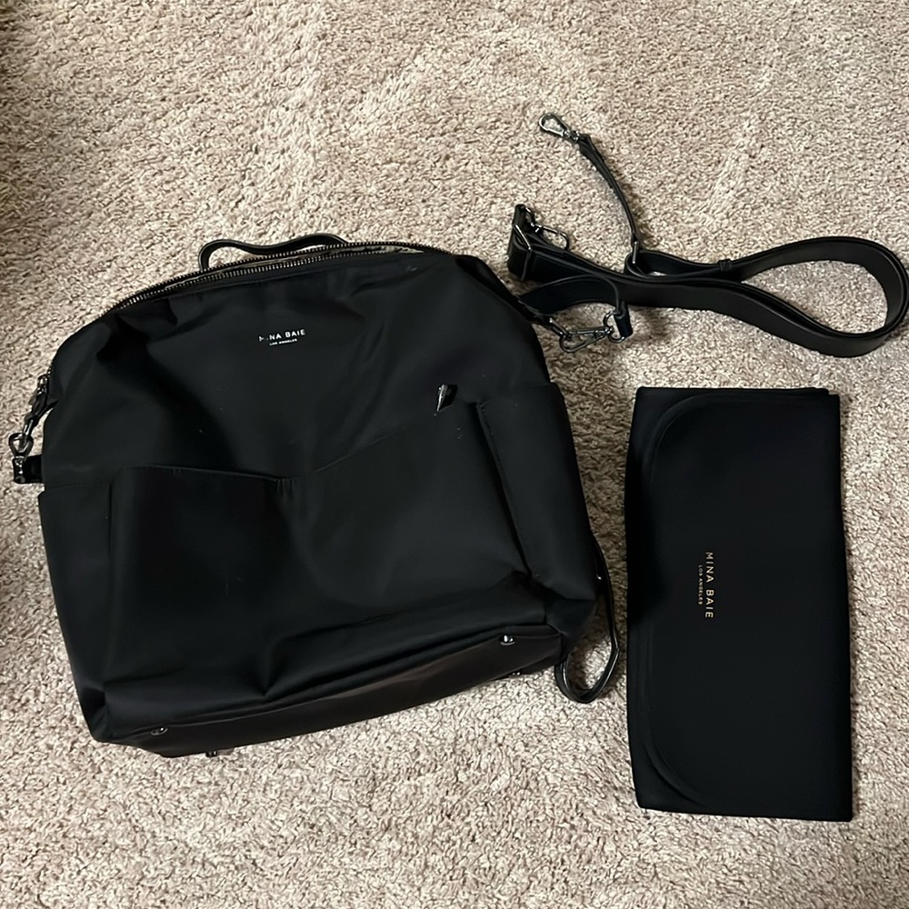 Mina Baie diaper backpack with carrying strap and changing pad